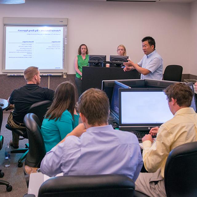 Business information systems professor in classroom